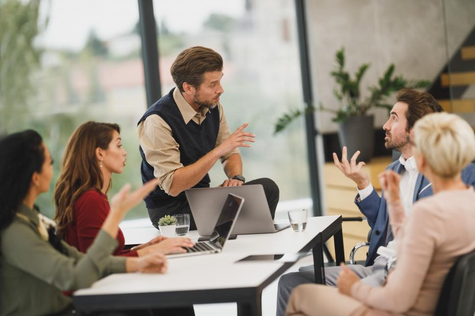 Meeting of people talking about technology